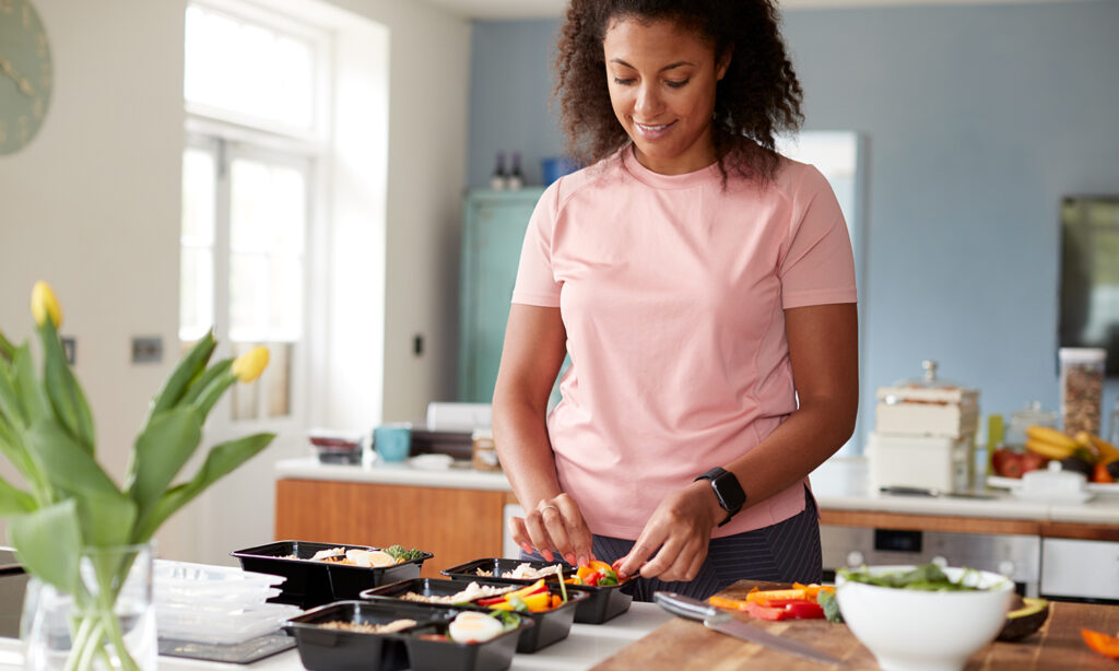 woman preparing meals for meal plan